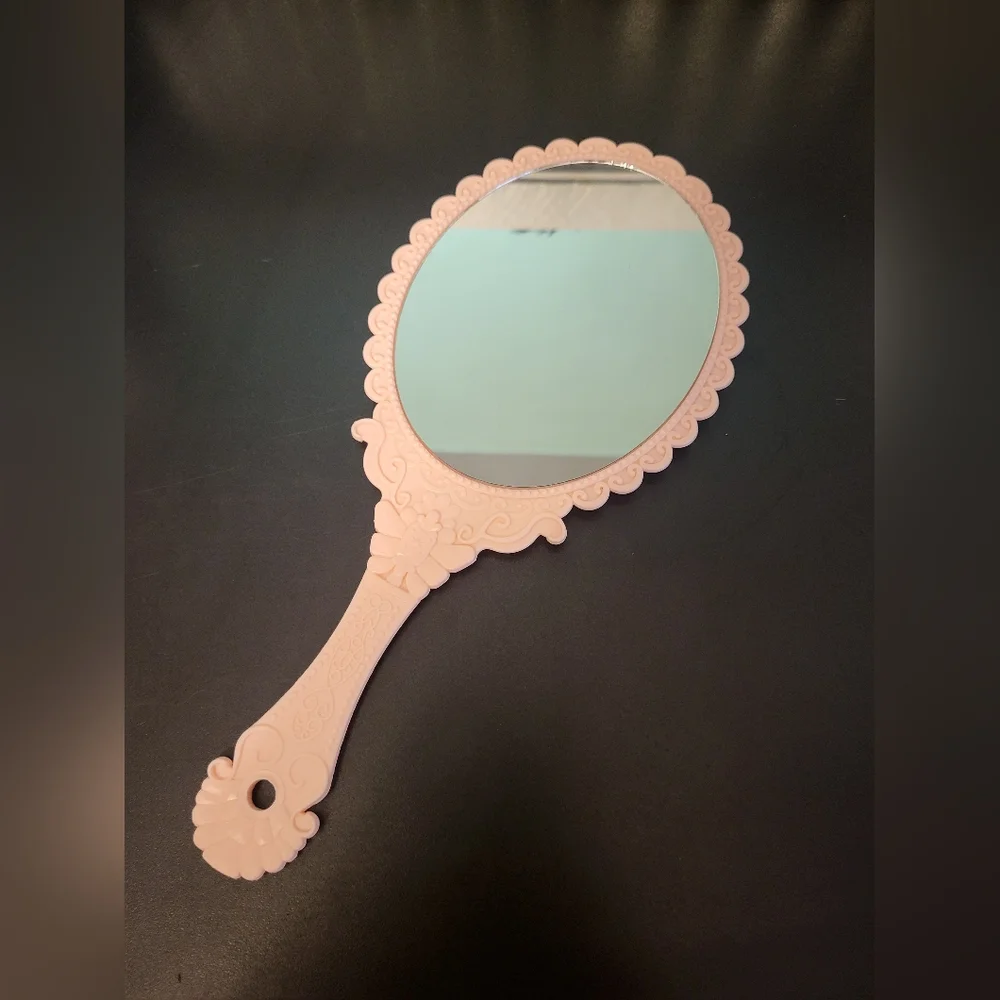 Pink plastic fantasy hand mirror